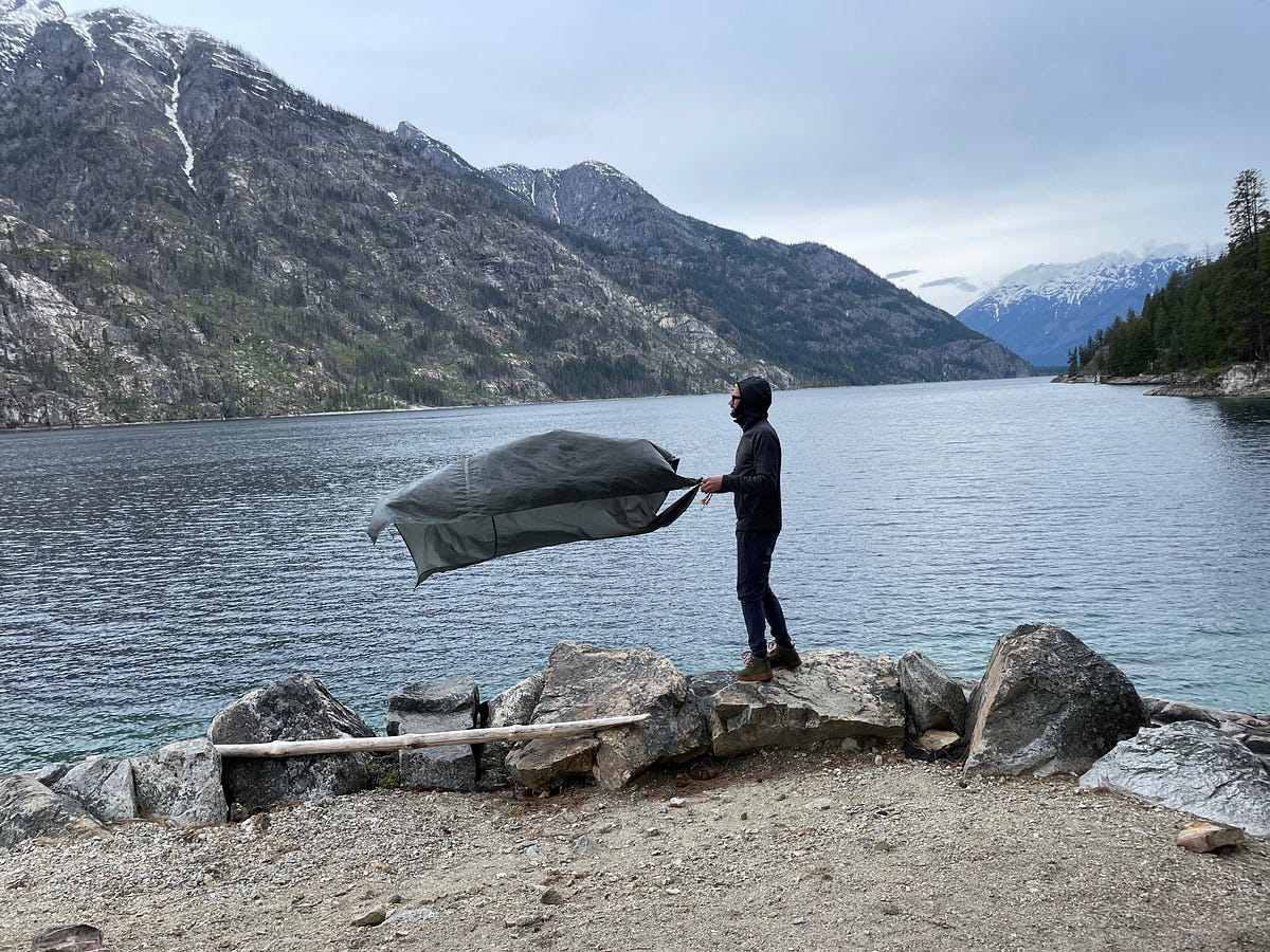Cas setting up our tent at the windiest spot in Lake Chelan.